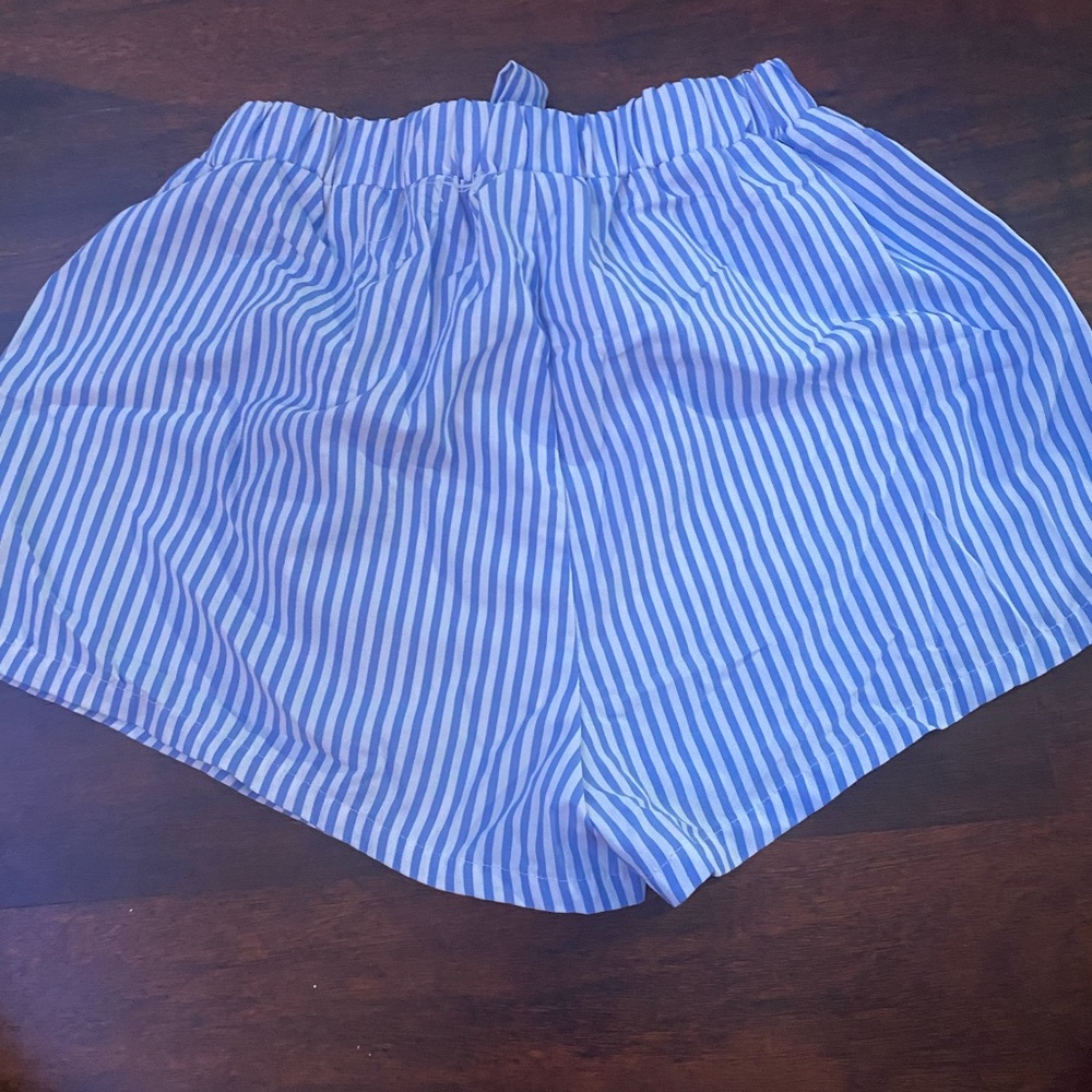 white and blue striped shorts with belt